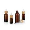 30ml 50ml Clear Amber Glass Dropperflaska med bambu keps 1oz glasflaskor för eterisk olja