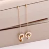 Pendientes de diamantes de cristal Encanto Oro Titanio Acero Doble anillo Herida Borla romana Números Pendientes para mujer Regalo Jewel320D