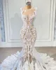 Abiti da sposa sexy a sirena con collo trasparente 2021 Abiti da sposa di lusso con applicazioni in pizzo con piume vestido de fiesta