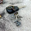 Rowerowe pierścienie Retro Splot Skórzany Sport Bike Charm Keychain Posiadacz Torba Wisi Dla Kobiet Mężczyzn Moda Biżuteria Will I Sandy