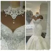2021 Sexy Luxury Dubai Árabe Sirena Vestidos de novia Vestidos de novia Cuello alto Ilusión Apliques de encaje Crystal Beaing Plus Size Tull186k