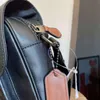 Unisex erkek messenger çantaları siyah evrak çantaları tasarımcı crossbody moda patchwork omuz çanta harfleri kasplar kapak çapraz gövde315i