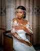 Arabiska Aso Ebi Lace Mermaid Bröllopsklänningar 2021 Afrikansk Nigerian Sheer O-Neck Långärmad Trädgård Täckt Knappar Brudklänningar Robe de Mariée