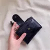 Perforerad lyx känd designer handväskor Tasseled multi-funktion kortväska inuti dragkedja Små handväska äkta läder plånbok koppling väskor