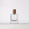 Lege glazen fles parfum hervulbare 50 ml lege crimpless pomp houten deksel cosmetische verpakking platte vierkante doorzichtige dikke bodem spuitflessen