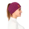 ファッションの冬の通気性ビーニーPonytailの女性のためのトップニットの帽子暖かい耳の保護キャップ7色の混合卸売