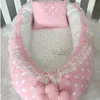 pink travel crib