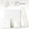 white leather boxes