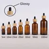 30ml 50ml Clear Amber Glass Dropperflaska med bambu keps 1oz glasflaskor för eterisk olja