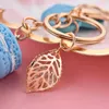 Kvinnor Ny Macaron Cake Keychain Pu Love Alloy Leaf Keychains Charm Bag Pendant Key Ring Party Gift Smycken