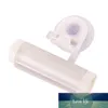 Spremiagrumi multifunzione a ventosa Spremiagrumi a parete Tubo di rotolamento in plastica a parete Spremiagrumi manuale Detergente per il viso Dispenser di dentifricio Prezzo di fabbrica design esperto