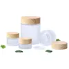 Hochwertige 5g-50g Mini-Milchglas-Cremeflaschen, runde Kosmetikdosen, Handgesichtsverpackungsflasche mit Holzmaserungsabdeckung