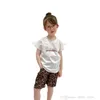 Designer Barnkläder Satser 2022 Mode Baby Boys Girls Letter Printed Short Sleeve T-shirt + Kjol / Korta 2st Passar Kids Fall Outfits S1999