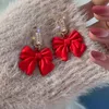 boucles d'oreilles noeud pompon