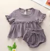 INS Vestiti per bambini da bambina Set di due pezzi Estate Tinta unita O-collo Ruffles + Short 100% cotone Set di abbigliamento per bambini