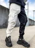Мужские брюки Осень 2021 Светоотражающая полоска дизайн Jogger Men Свободный фитинг Негабаритные работы Брюки Tide Drawstring Щека