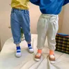 Primavera unisex moda jeans rasgados niños y niñas pantalones de mezclilla con flecos 1-6Y 210508