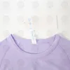قمصان يوجا رياضية للسيدات ارتداء Swiftlys Tech 1.0 قمصان نسائية بأكمام قصيرة مقاومة للرطوبة من الصوف المحبوك عالي المرونة للياقة البدنية تي شيرت أنيق