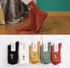 Großhandel Mode Designer Socken Männer Frauen Cartoon Fuchs Astronauten Stickerei Drucken Feste Farbe Kämmte Baumwollstrümpfe Winterkomfort Dicke Halten Sie Warm Socke
