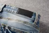 Designer de moda azul dos homens magro jeans magro casual fluff dobras buracos calças da motocicleta rasgado denim script romano letter248g