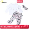 $50-25 0-5Y printemps fleur enfant en bas âge enfant filles vêtements ensemble volants hauts blancs nœud pantalon tenues 210515