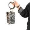 Pu nyckelring mynt purses armband plånbok kvinna handväska läder tofs pendelles designers handväskor leopard solros tryck damer väska226g