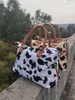 Leopardtryck modedesigners Duffel Påsar kvinnliga resväskor Borstiga handväskor stora kapacitetshållare.