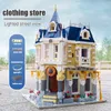 The MOC Costume Shop With Led Parts Building Blocks MOLD KING 11005 New Street View Edifici Assemblaggio Mattoni Modello Giocattoli di compleanno per bambini Regali di Natale per bambini