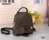 Echtes Leder Mini Herren Damen Outdoor Sport Rucksack Umhängetaschen Totes Handtasche Cross Body Kosmetiktasche Handytasche Geldbörsen Geldbörsen L610