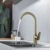 gold faucet with stainless steel sink