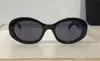 Lunettes de soleil design en gros de mode 40194 petit cadre ovale simple style généreux lunettes de protection uv400 de qualité supérieure avec étui à lunettes