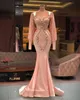 Plus La Taille Arabe Aso Ebi Luxueux Sirène Sexy Robes De Bal Pêche Rose Dentelle Perlée Manches Longues Soirée Formelle Partie Deuxième Recep265r