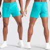 Jogger Snabbtorkande Fitness Mäns Sportbyxor Sommarstrand Casual Mäns Shorts Fashion Herrkläder X0628