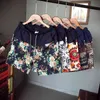 Männer und Frauen Modelle Freizeit Shorts Mode Baumwolle und Leinen Nähen Sommer Marke Perlen Blumen gedruckt Strand Shorts 210322