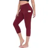 Kvinnor sträcker sig 3/4 yogabyxor leggings fitness som kör gym sportfickor Aktiv kalvlängd byxor capri byxa hög midja leggins H1221