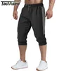 TACVASEN Pantalon capri 3/4 pour homme Joggers Short de survêtement Fitness Workout Running Pantalon en coton avec poches Short d'été respirant G1209