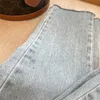 Calças jeans casuais femininas finas com logotipo e zíper decoração de botões calças respiráveis confortáveis para uso ao ar livre