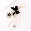 Fashion Imitation Pearl Parfym Bottle Keychain Car Ring Women Bag Charm Tillbehör Söt Bow Key Chain Creative Keyrings G1019