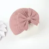 Ins nya 5 färger mode baby beanie cap med båge knut hår tillbehör solid färg nyfödd hatt 17x16cm / 24,4g