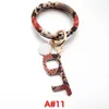 Wristlet Nyckelkedja Armband med dörröppnare Knapp Pusher Party Favorit KeyRing Kvinnor Bangles Keychain RRF12747