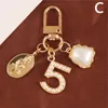 Cute Heart Keychain Charms Sweet Small Gifts Ins Metal Jewelry Pearl Pendant Car Bag Key Ring Holder Ladies Fashion Accessories