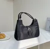 Kvinnliga väskor nisch design handväska mode solid färg nylon stygn underarmsäck