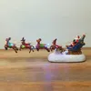 Escena de la escena de las decoraciones de la Navidad Tirando el carro Casas Casas del pueblo Decoración del hogar Artesanía Adorno para niños