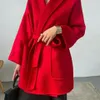 Manteaux de vêtements d'extérieur pour femmes manteau ample en cachemire de conception courte de vague d'hiver avec ceinture