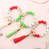 Gioielli 17 colori Natale Nappa di legno Bracciale con cordino di perline Portachiavi di Natale Perline in silicone per uso alimentare Bracciali Donna Ragazza Portachiavi Cinturino da polso