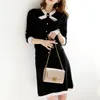 Autumn Winter High Quality Knitted Two Piece Set Women Long Sleeve Bow Sweater Top + Elastic Waist Skirts Suits 2 210514
