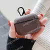 Diseñador de moda Accesorios para auriculares Estuches para AirPods pro 1 2 Estuche rígido de alta calidad Letras de lujo Paquete de protección impresa Gancho Bolsas para auriculares