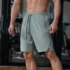 svarta löparshorts för män med ficka med dragkedja Sommar Quick Dry Fitness Bodybuilding Träningsbyxor Gym Sport Träningsbyxor