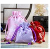 8 * 10 10 * 14cm Tissu de tache de brocart fleur de prunier Organisateur de bijoux Pochettes à cordon Sac d'emballage cadeau Flocked Favor Holders sacs business shop promotion multi color