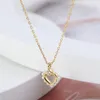 Pendentif Colliers Bijoux européens et américains en gros simple creux forme d'amour incrusté collier de perles